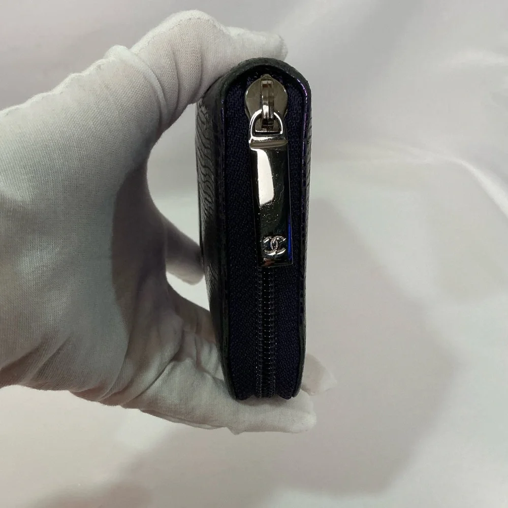 Authentic CHANEL Iridescent Purple Caviar Zip Lizard Embossed Yen Wallet
